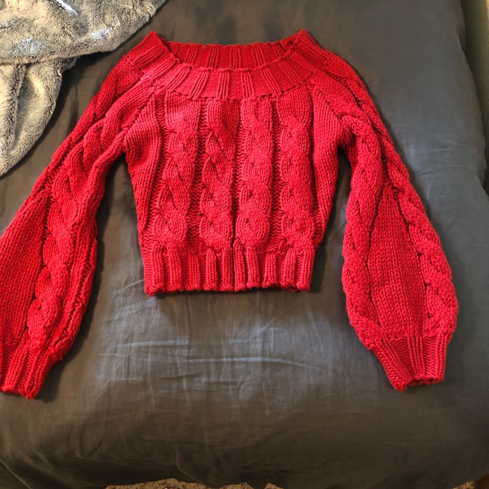 Red bell sleeved knit sweater